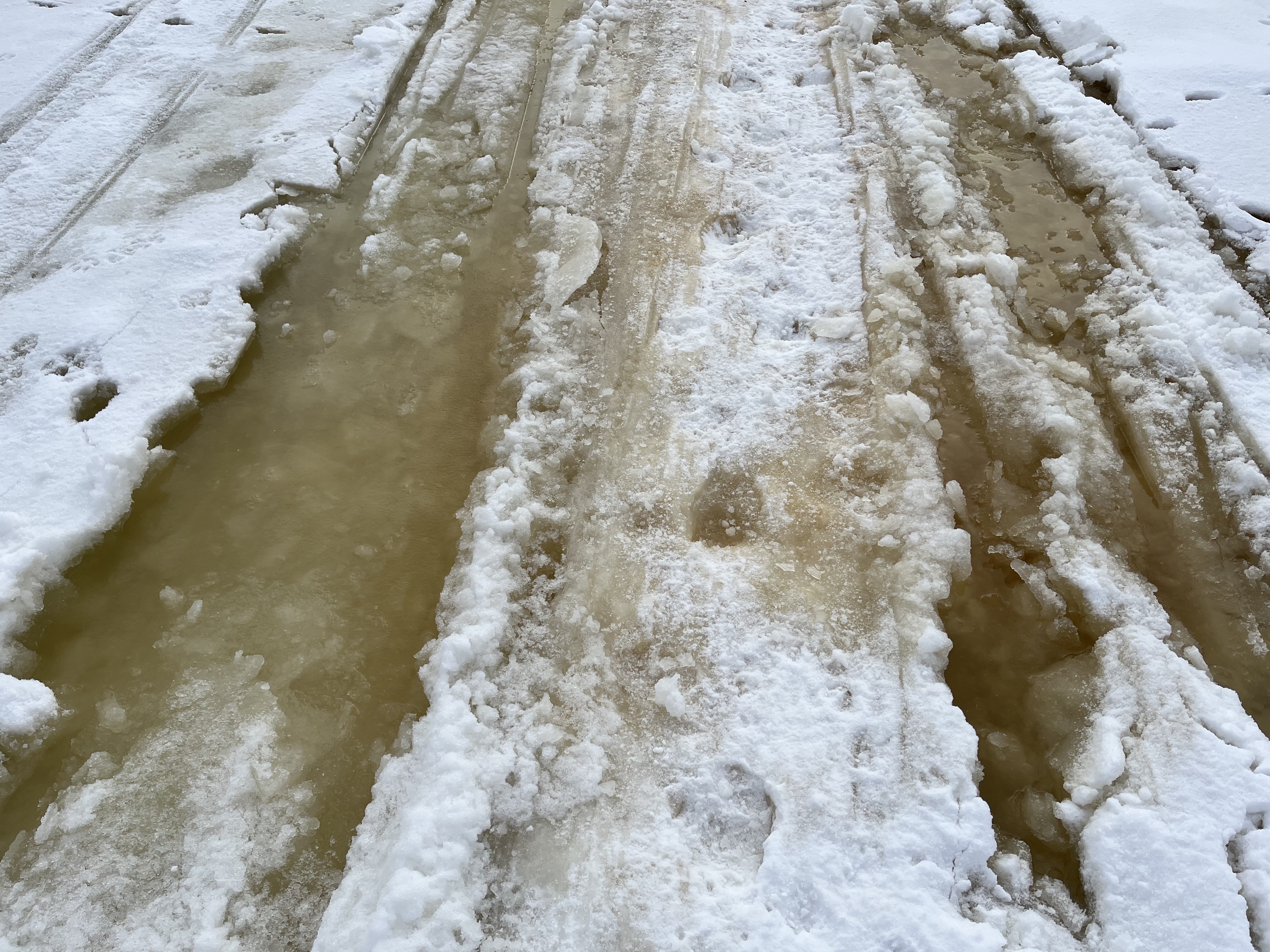 The Bain of Winter: Slush on TOP of lake ice...